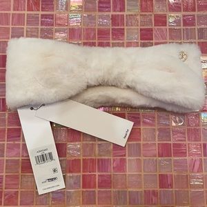 White faux fur ear head band.